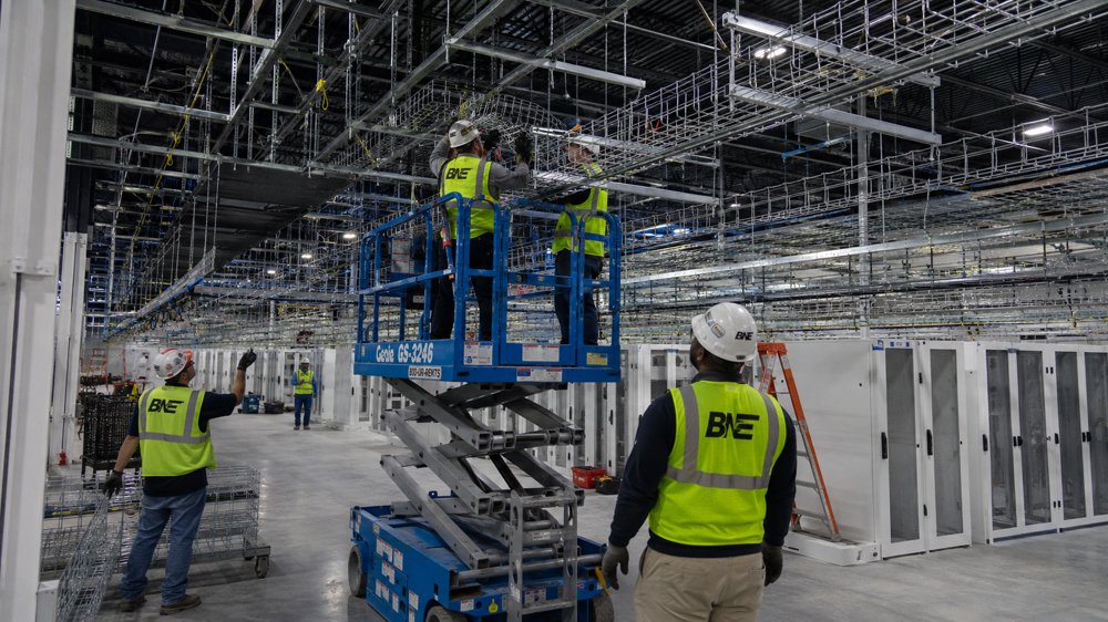 BNE crew installing overhead conveyance systems in a data center